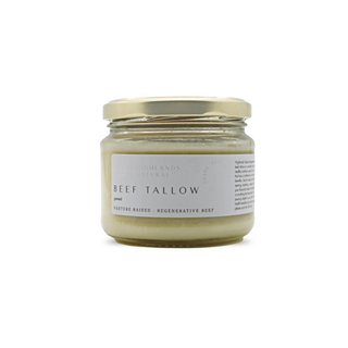 A jar of Highlands Natural Beef Tallow with the label showing the product name, rendered from grass-fed Australian beef by Highlands Natural. The jar is sealed with a gold lid.