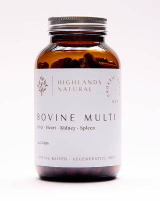 A bottle of Highlands Natural Bovine Multi supplements with a label showing the product name and that it is made from bovine liver, heart, kidney, and spleen.
